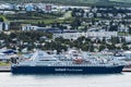 View at Akureyri city, the capital of Northern Iceland viewed from eastern coast of Eyjafjordur fjord. The Harbor and Cruise ship